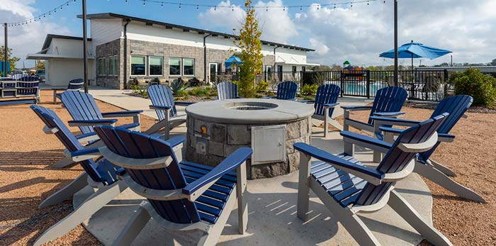 Chairs around fire pit at Jet Stream Waller RV Park in Houston Texas